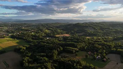 an aerial view of a forested area with mountains at Szumią Dęby - Marcyporęba in Marcyporęba