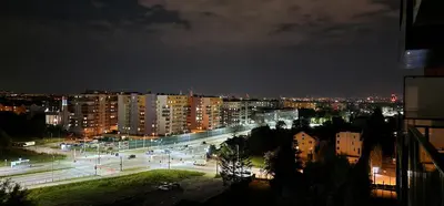 a city at night with traffic lights and buildings at Sunrise Apartament in Kraków