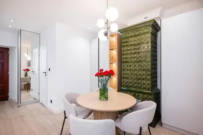 a dining room with a table and chairs at Apartment Grodzka 27 in Kraków