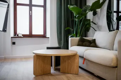 a living room with a couch and a table at Apartment Grodzka 27 in Kraków
