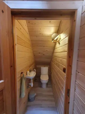 a small bathroom with a toilet and a sink at Agroturystyka Z Głową w Chmurach - Zawoja in Zawoja