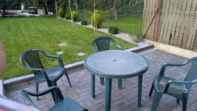 a table and two chairs and a table and a table and chairs at Centrum BAL Apartment in Kraków