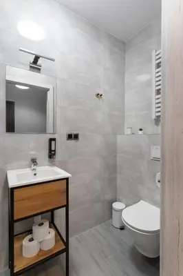 a white bedroom with a large bed and a window at NEXT TO Royal Castle Elegant Apartments Kraków Old Town in Kraków