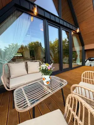 a screened in porch with a table and chairs at Julianowe Wzgórze in Czchów