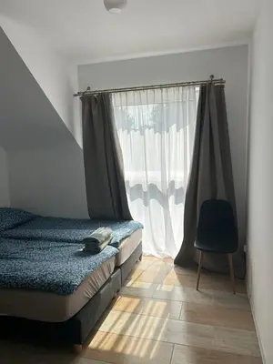 a bedroom with a bed and a window at Mieszkanie w zaciszu in Kraków