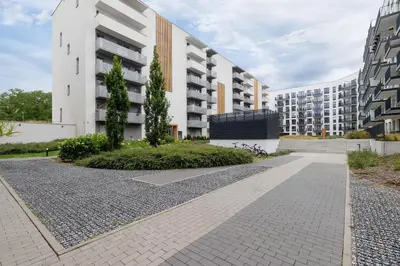 a walkway in front of a building at Prandoty 10C Cozy Apartment with Balcony & Parking in Krakow by Noclegi Renters in Kraków