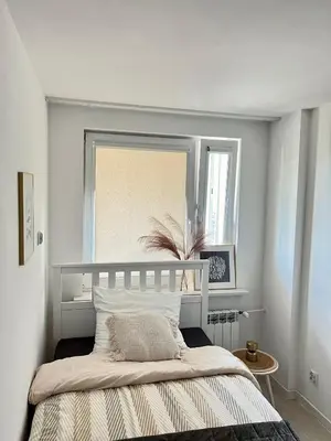 a bedroom with a bed with a mirror above it at Apartment Kraków-Stare Miasto in Kraków