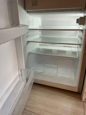 an empty refrigerator with its door open on the floor at Apartment Kraków-Stare Miasto in Kraków