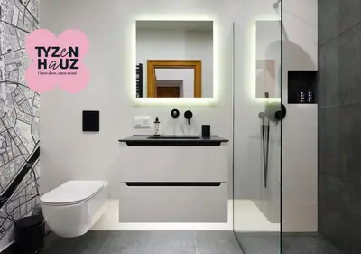 a white bathroom with a toilet and a sink at Golden Market Square Apartments by Tyzenhauz in Kraków