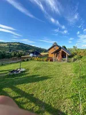 a view of a farm with a house at Domek całoroczny w Porębie wielkiej z widokiem na góry in Poręba Wielka
