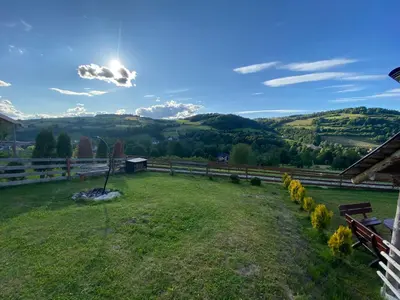 a view from the backyard of a house with a view of the mountains at Domek całoroczny w Porębie wielkiej z widokiem na góry in Poręba Wielka