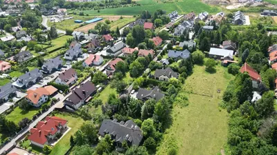 an aerial view of a residential neighborhood with houses at Apartament 294 W Cieniu Drzew by BookingHost in Giebułtów
