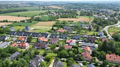 an aerial view of a small town with houses at Apartament 294 W Cieniu Drzew by BookingHost in Giebułtów