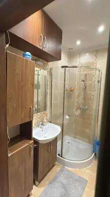 a bathroom with a shower and a sink at Dawidapart in Kraków