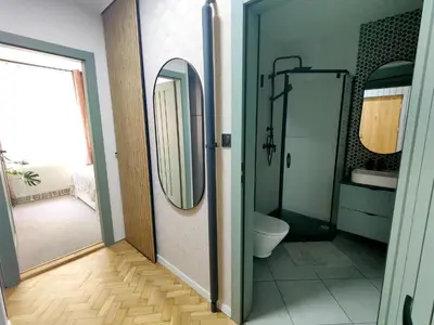 a bathroom with a toilet and a mirror at Positive Vibes in Kraków