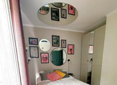 a bedroom with a bed and a mirror at Positive Vibes in Kraków