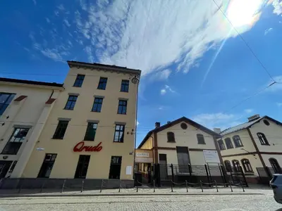 a building with a sign on the side of it at Chick 1bdr loft in Krakow's city centre in Kraków
