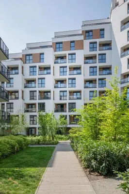 an apartment building with a walkway in front at Apartamenty Lew Invest obok Rynku Głównego, Parking w cenie in Kraków