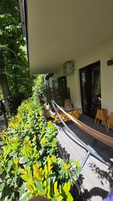 a group of plants in front of a building at Luxury River Side apartament, Free parking in Kraków