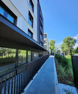 a walkway in front of a building at Luxury River Side apartament, Free parking in Kraków