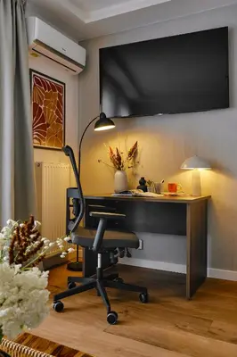 an office with a desk and a chair at UR4N Apartment - Czarnogórska in Kraków