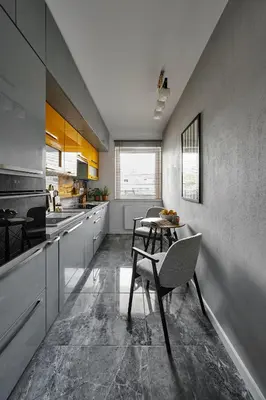 a kitchen with a table and chairs in it at UR4N Apartment - Czarnogórska in Kraków