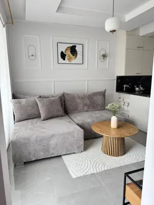 a living room with a couch and a table at Chill&Love Apartament