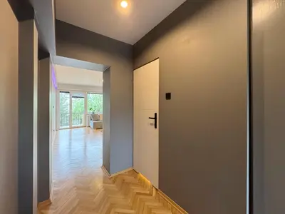 a living room with a couch and a bed at Fenna loft in Kraków