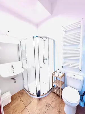 a bathroom with a shower and a toilet and a sink at Gościniec i Restauracja Salton in Bochnia
