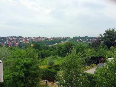 a view of a city from a hill with trees at Gościniec i Restauracja Salton in Bochnia