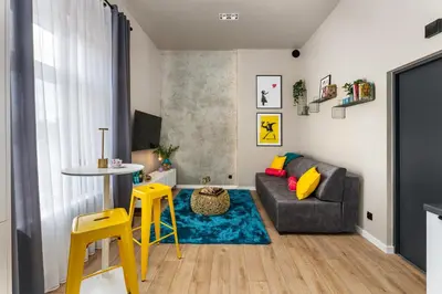 a living room with a couch and a table at LIFESTYLE Apartments in Bochnia