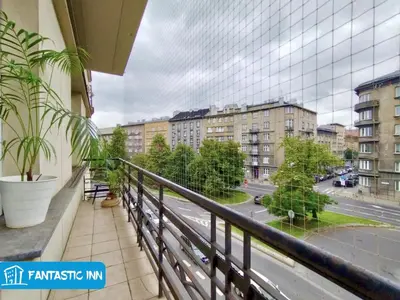 a balcony with a view of a street and buildings at Fantastic-Inn Kraków - Słowackiego in Kraków