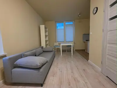 a living room with a couch and a table at Mieszkanie 3 in Kraków