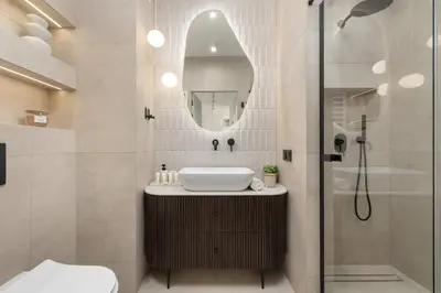 a bathroom with a sink and a mirror at Prandoty Stylish Apartment with Balcony & Parking in Cracow Old Town by Renters Prestige in Kraków