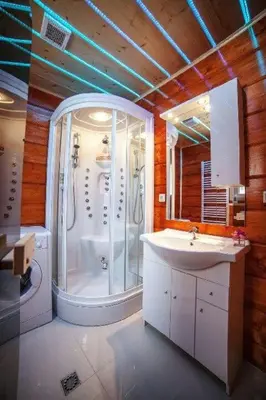 a bathroom with a shower and a sink at Domek z widokiem na góry in Targoszów