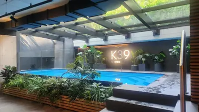 a swimming pool with plants in a building at Nice time in Hart of Cracow,Gym&Pool&Sauna and free parking in Kraków