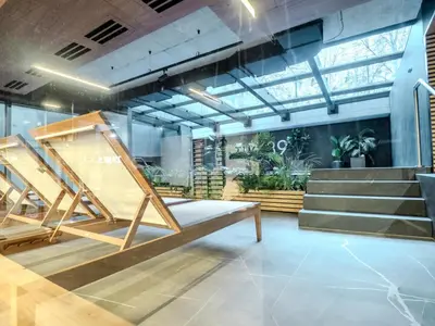 a room with stairs and a bench in a building at Nice time in Hart of Cracow,Gym&Pool&Sauna and free parking in Kraków