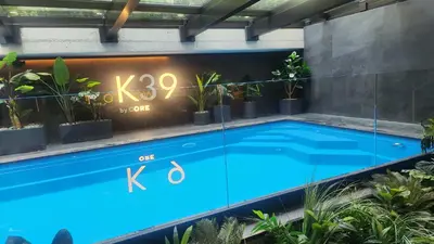 a large blue swimming pool with a clock on the wall at Nice time in Hart of Cracow,Gym&Pool&Sauna and free parking in Kraków