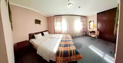 a bedroom with a large bed in a room at Zielona Paszkówka - sauna! in Paszkówka