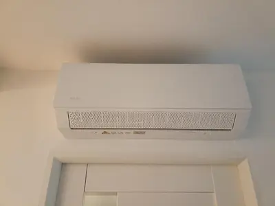 a white computer monitor on top of a ceiling at Apartament Maria in Oświęcim