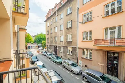 a view of a street with cars parked on the street at Kraszewskiego Apt - Balcony, Park & River nearby - by Rentujemy in Kraków