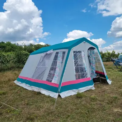 a tent on the grass in a field at Uszate Ranczo Jagoda in Rybna