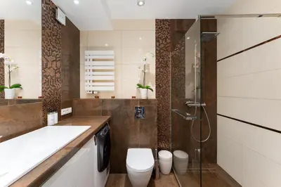 a bathroom with a toilet and a shower at Malila Premium Apartments Cracow Cystersów 20D in Kraków