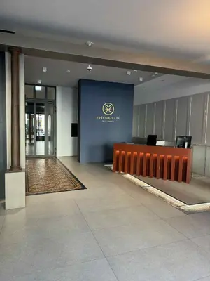a lobby with a reception desk in a building at The Velvet Apartment Kościuszki in Kraków