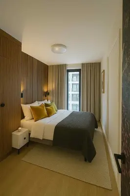 a bedroom with a large bed and a window at The Velvet Apartment Kościuszki in Kraków