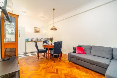 a living room with a couch and a table at Kazimierz Apt - Top Location - by Rentujemy in Kraków