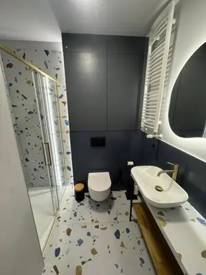a bathroom with a toilet and a shower and a sink at KULIG APART - Długa 82 - Kraków Old Town in Kraków