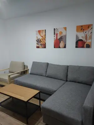 a white table and chairs in a room with windows at Sunny Family Zator Energylandia in Zator