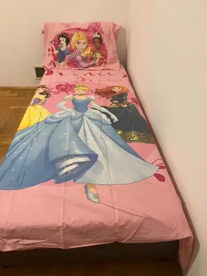 a bed with a disney princess blanket on it at HOTEL&RESTAURACJA DALLAS LuxUSAPL - 2026 NOWA WŁAŚCICIELKA ZAPRASZA!! in Myślenice