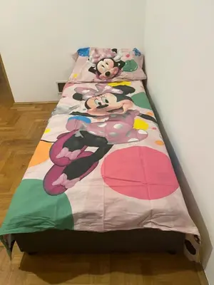 a bed with a hello kitty quilt on it at HOTEL&RESTAURACJA DALLAS LuxUSAPL - 2026 NOWA WŁAŚCICIELKA ZAPRASZA!! in Myślenice